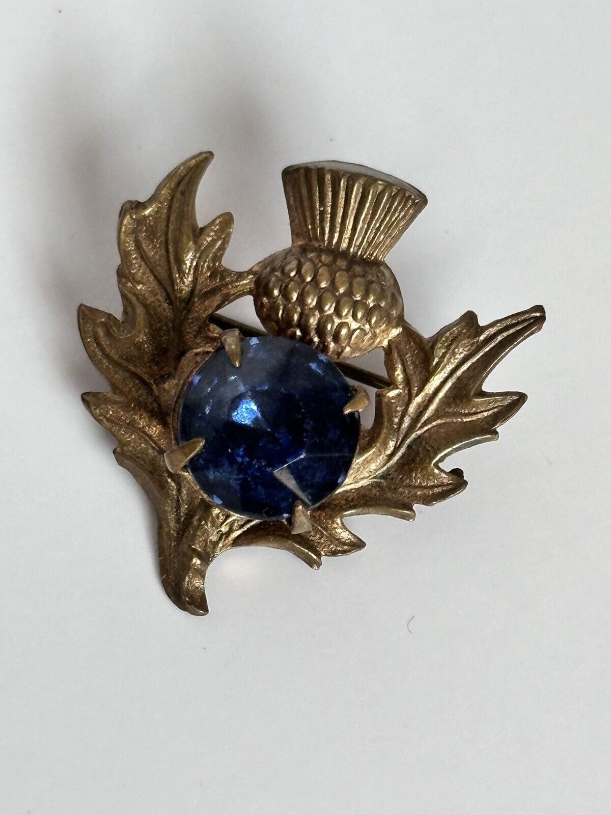 Vintage Gold Tone Thistle Brooch With Blue Glass Stone