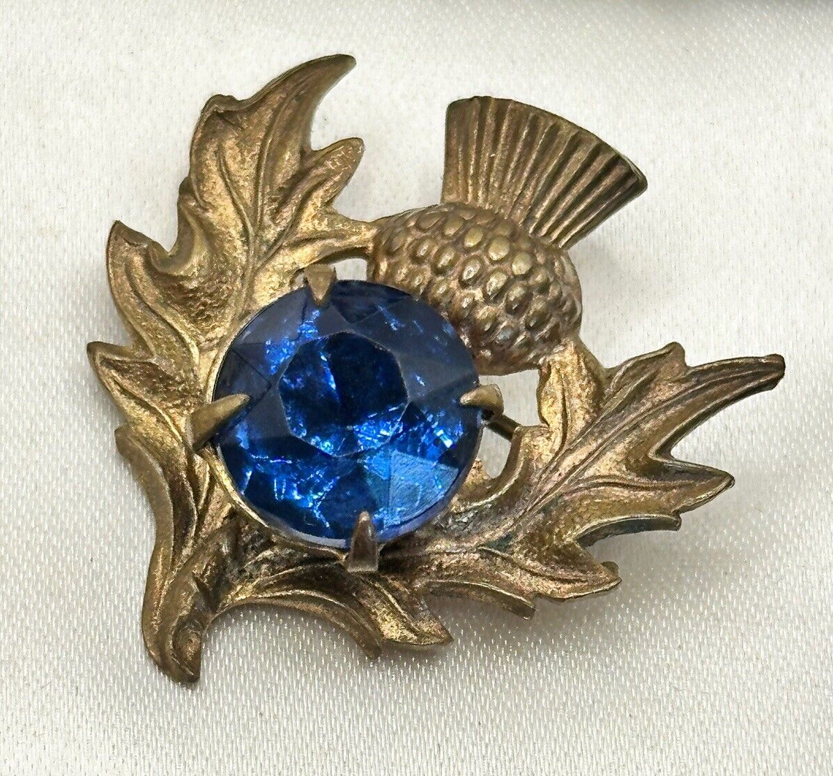 Vintage Gold Tone Thistle Brooch With Blue Glass Stone