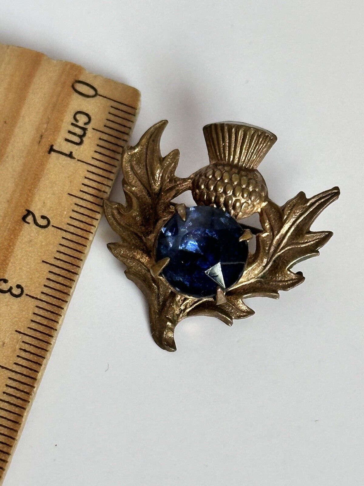 Vintage Gold Tone Thistle Brooch With Blue Glass Stone