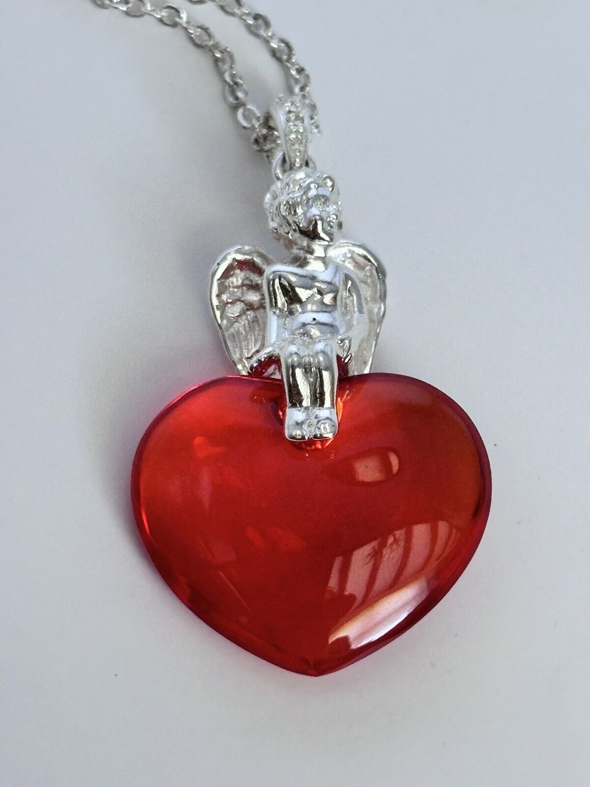 Vintage 1980s Rhodium Plated Cherub Glass Heart Necklace New Old Stock
