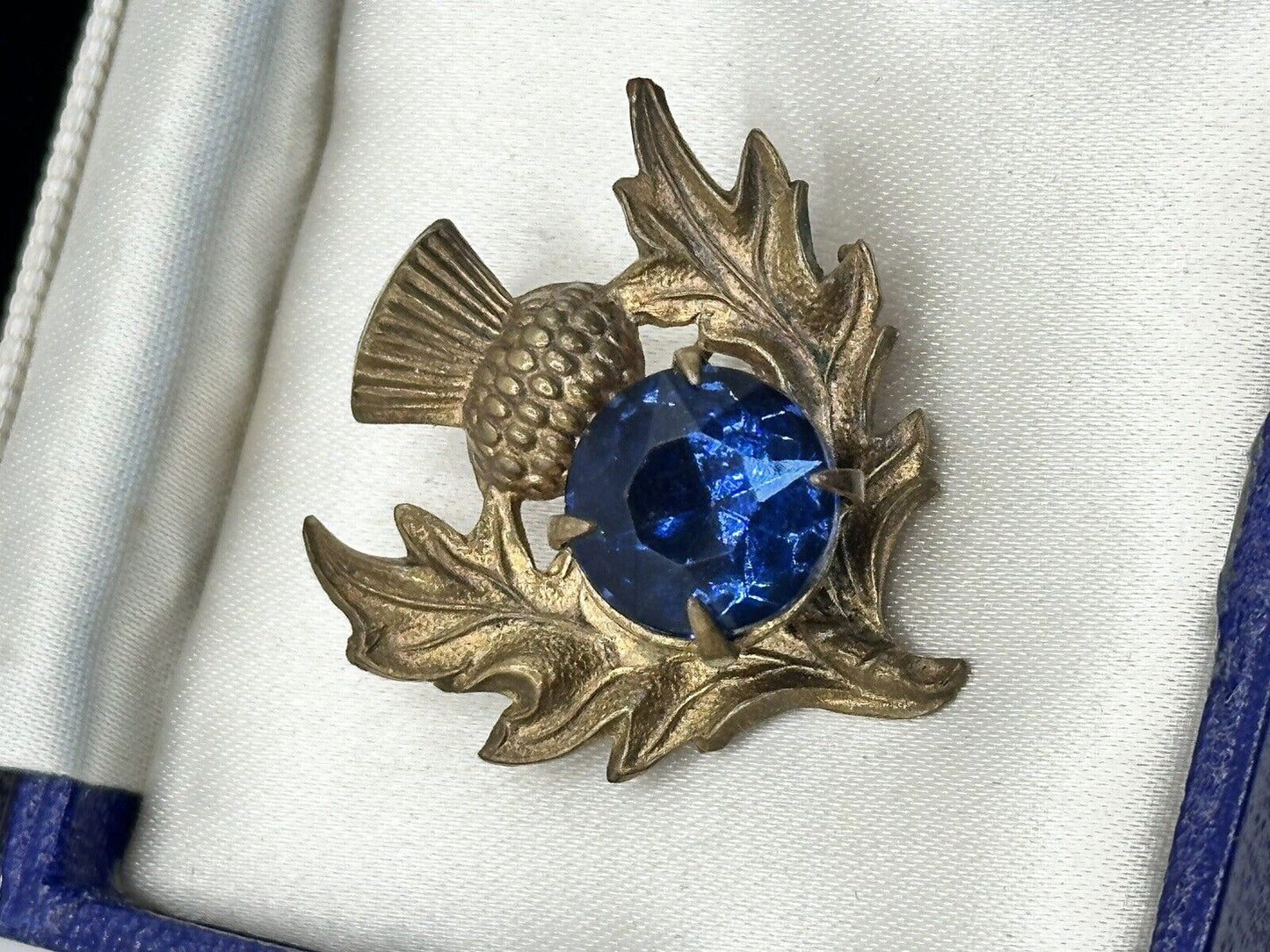 Vintage Gold Tone Thistle Brooch With Blue Glass Stone