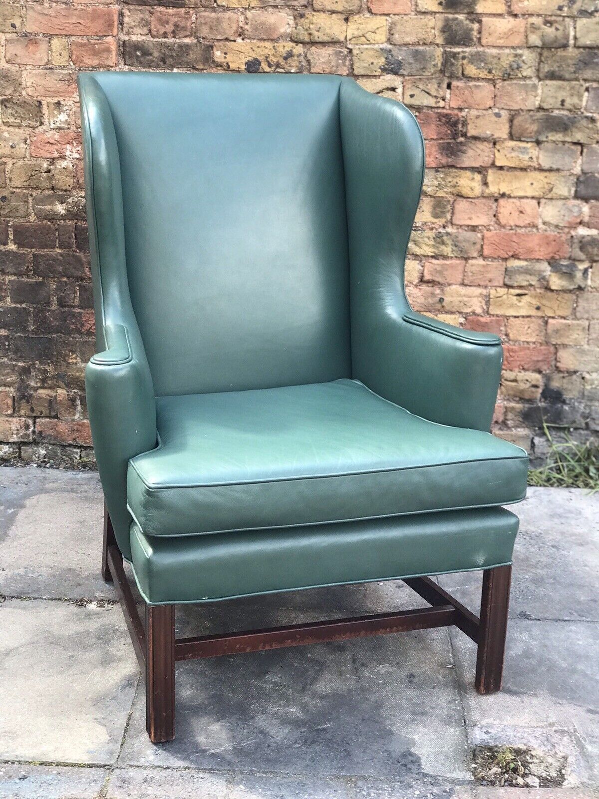 Green Leather Wingback Armchair.
