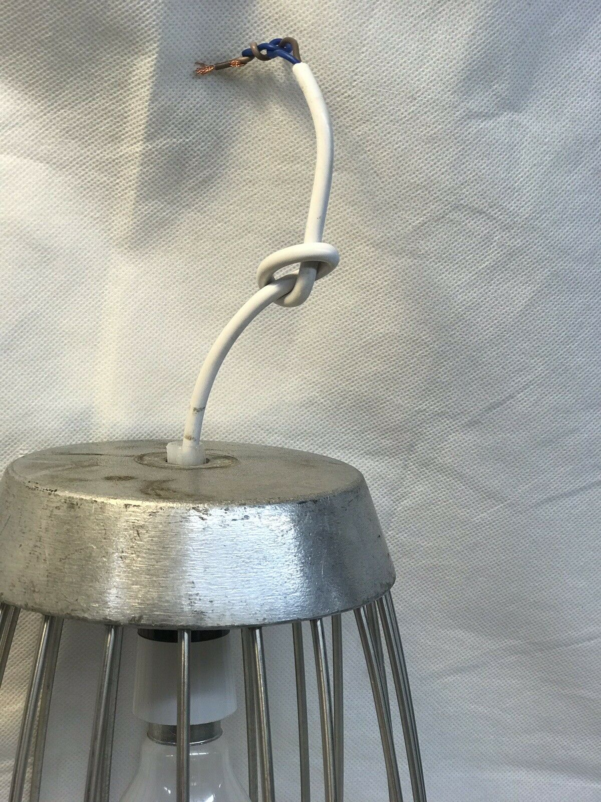 Large Industrial Whisk That Has Been Turned Into A Light Pendant