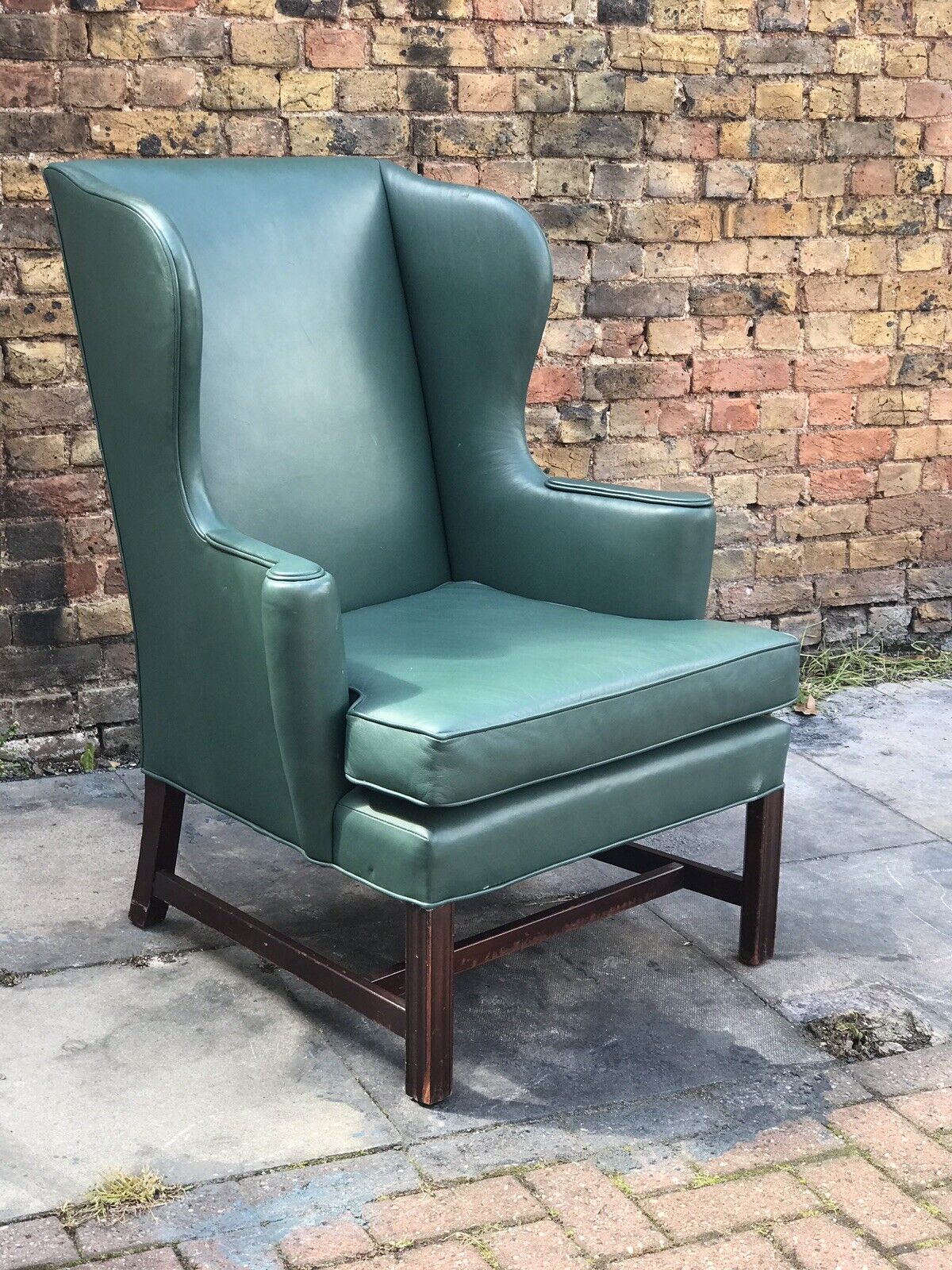 Green Leather Wingback Armchair.