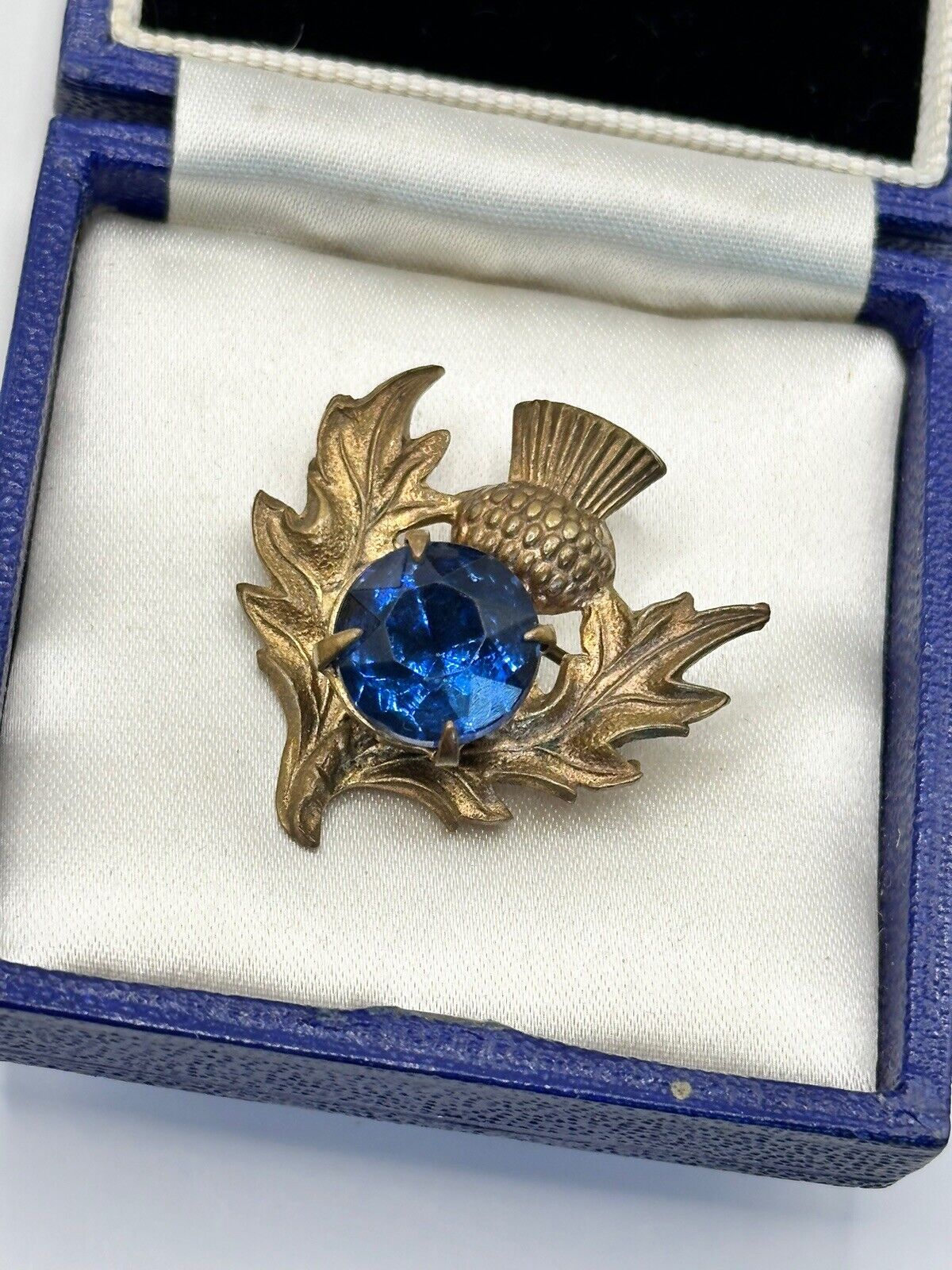 Vintage Gold Tone Thistle Brooch With Blue Glass Stone