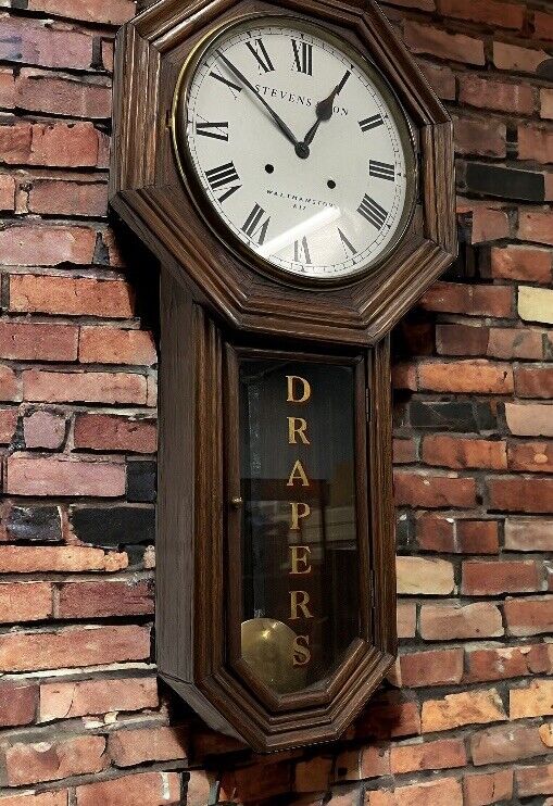 E17 Walthamstow Drapers Shop Drop Dial Wall Clock. Chimes on a gong.