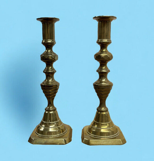 Antique Brass Candlesticks. 22.5 cms tall. With working candle pushers