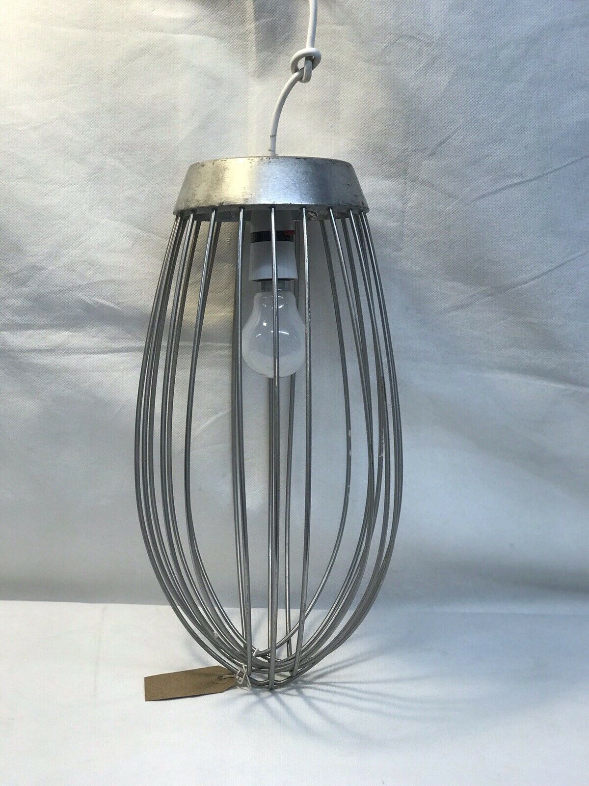 Large Industrial Whisk That Has Been Turned Into A Light Pendant